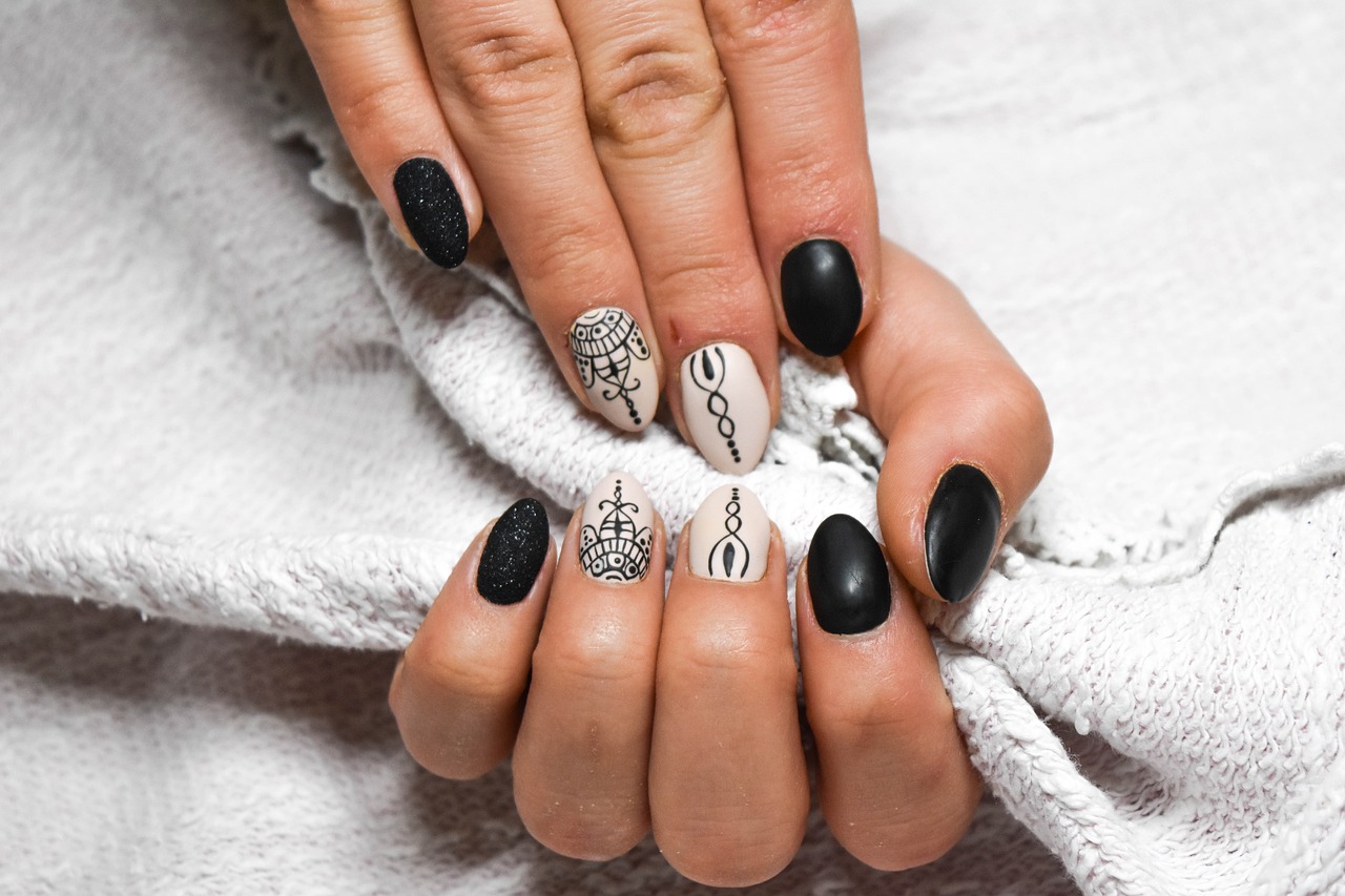 Woman's hands with black and white line design