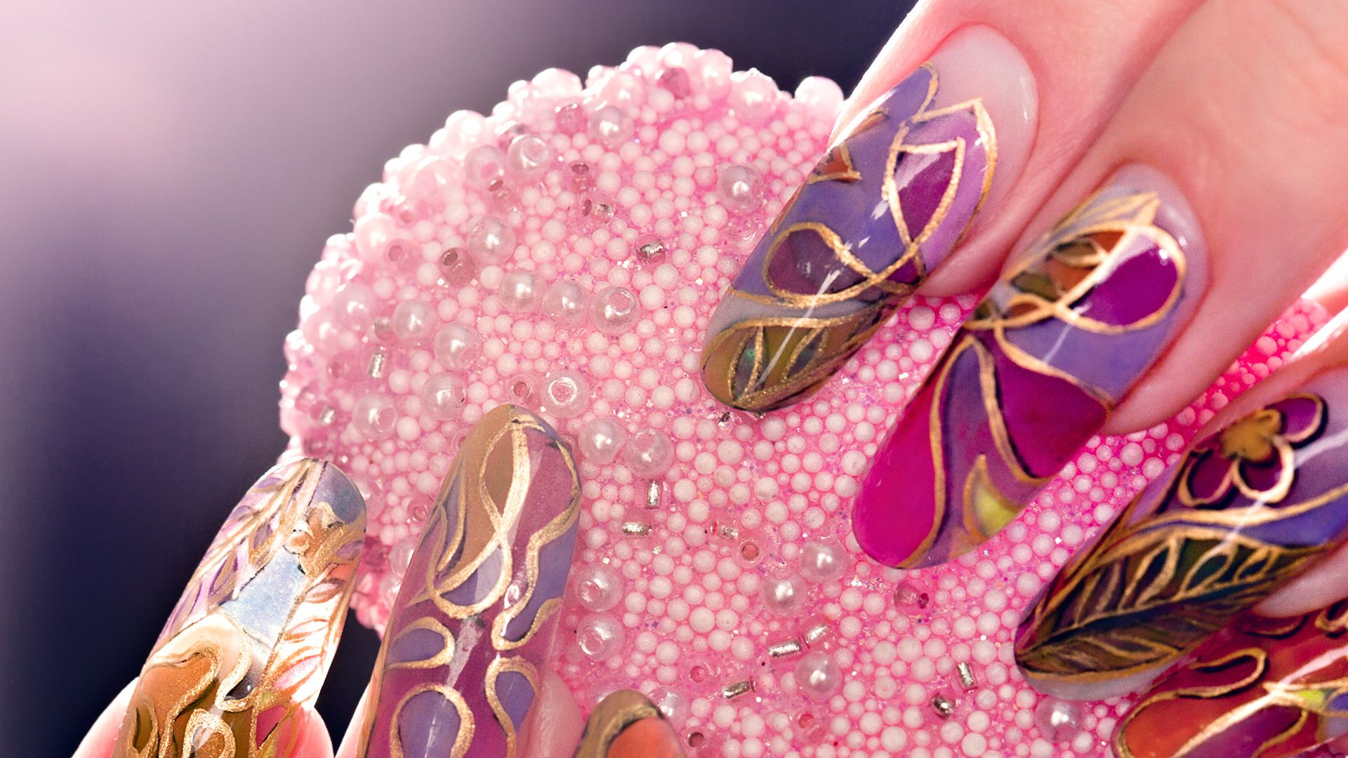 Beautiful nail design holding a sponge