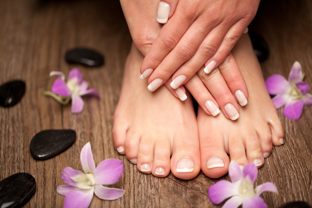 Beautiful hands and feet with nail tips