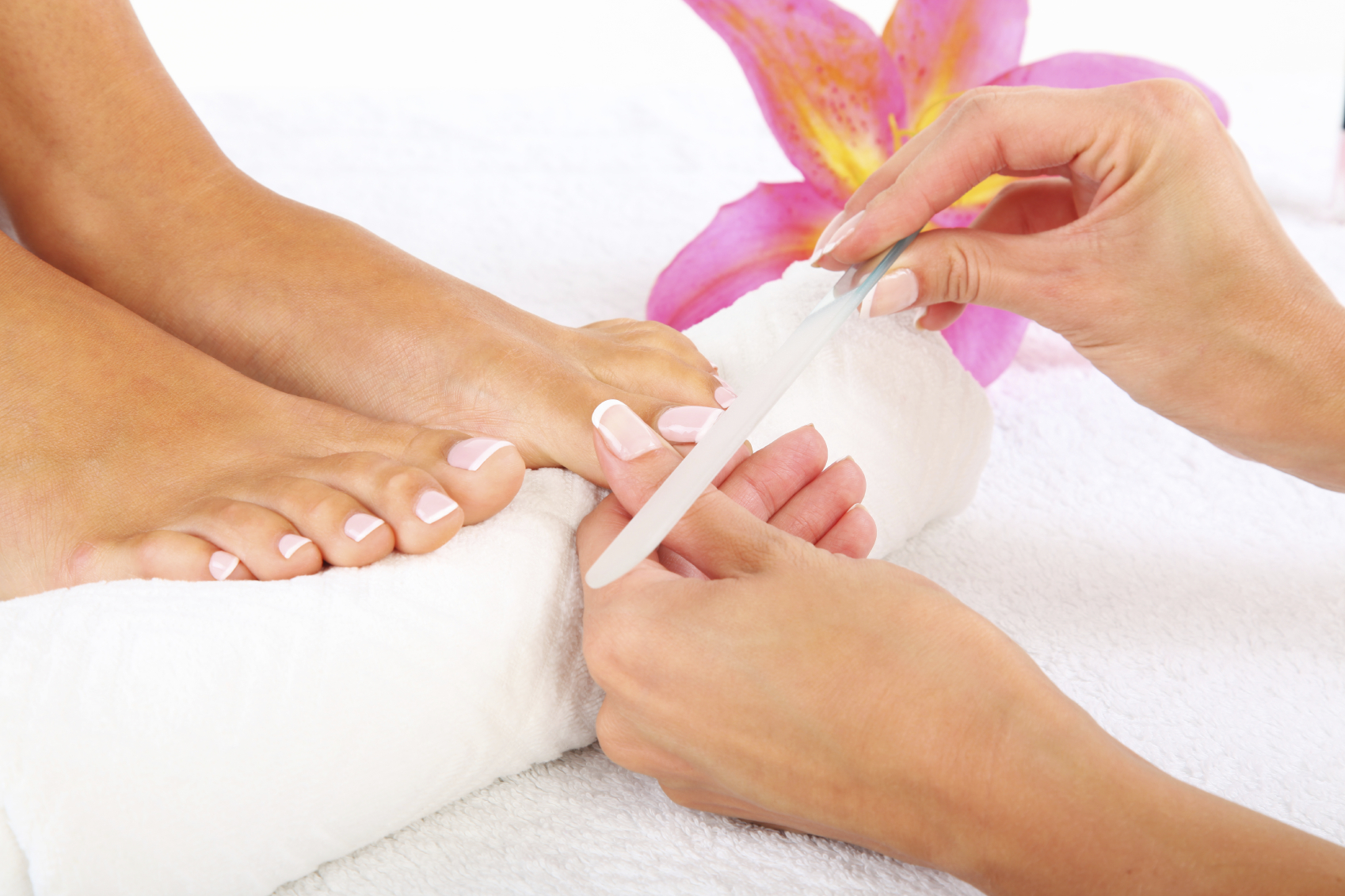 Nail manicurist painting red polish